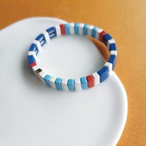 Roxanne Assoulin Rainbow Brite Gold Blue White Red Stretch Bracelet